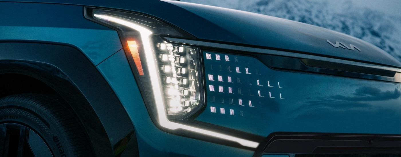 Passenger side headlight on a green 2025 Kia EV9 