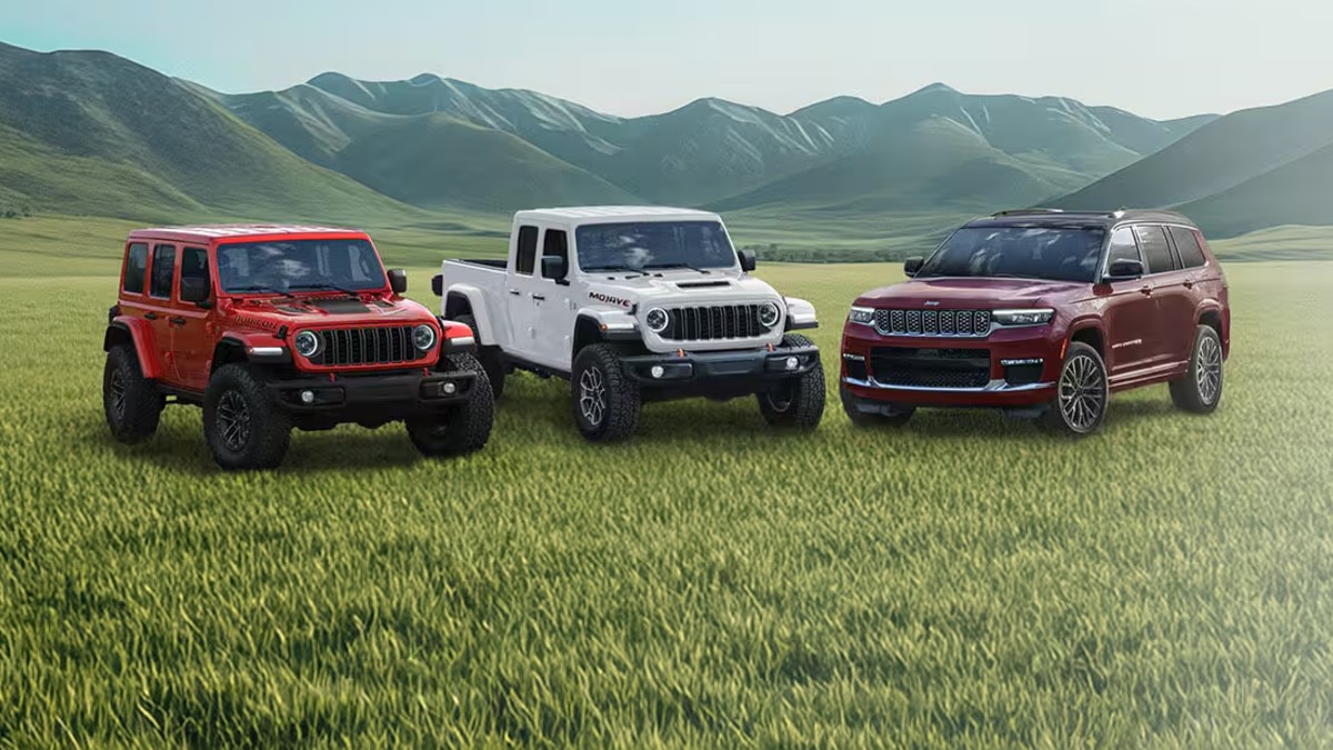 Three 2026 Jeep Lineup Vehicles on Grassy Field