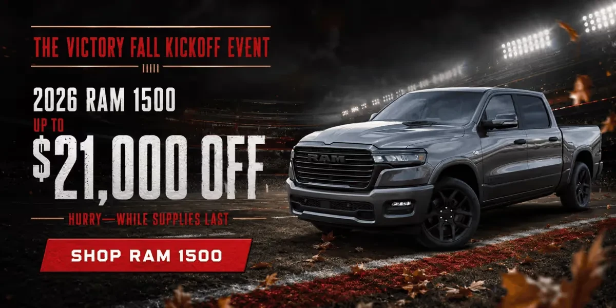 Promotional banner for the Victory Fall Kickoff Event: a gray 2026 Ram 1500 on a stadium football field, advertising up to $21,000 off while supplies last