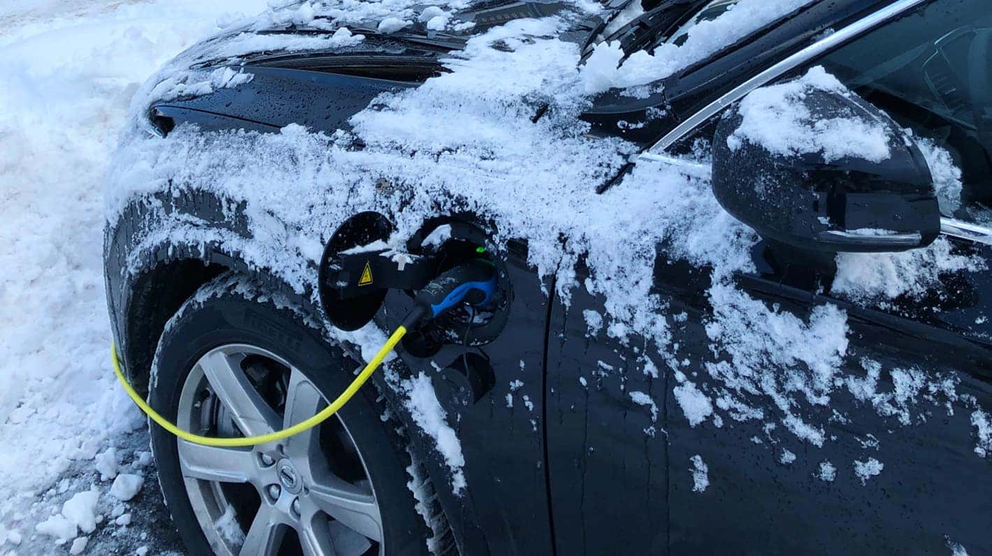 Electric vehicle covered in snow