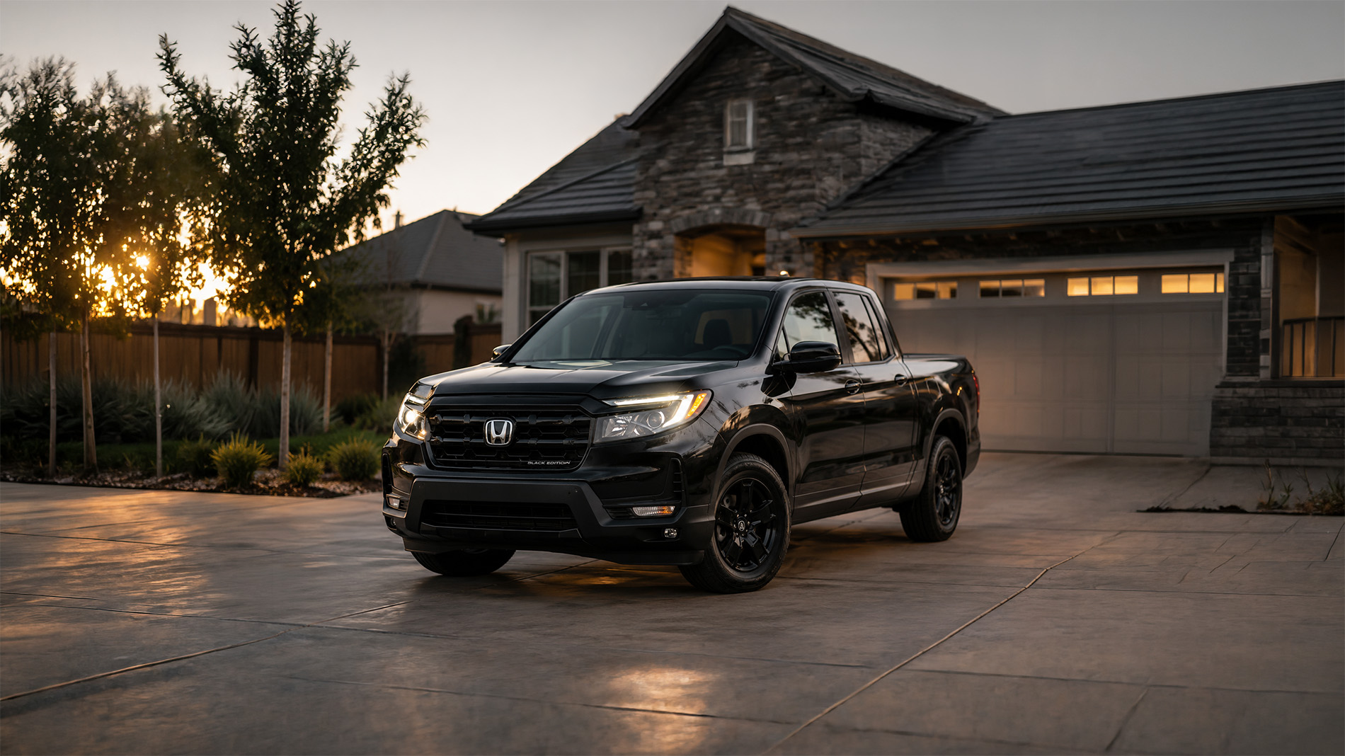 2026 Honda Ridgeline Black Edition trim level parked in the driveway of a Tracy CA home at sunset