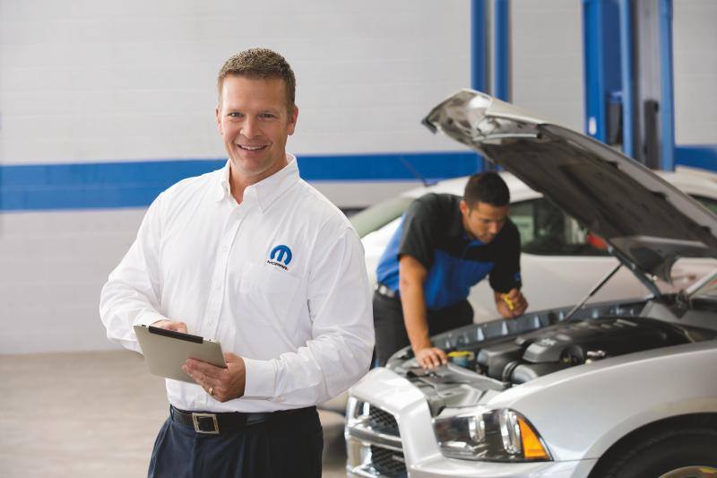 Mopar At Your Service technician working in the service department