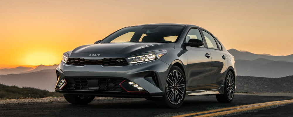 2023 Kia Forte Driving at Sunset