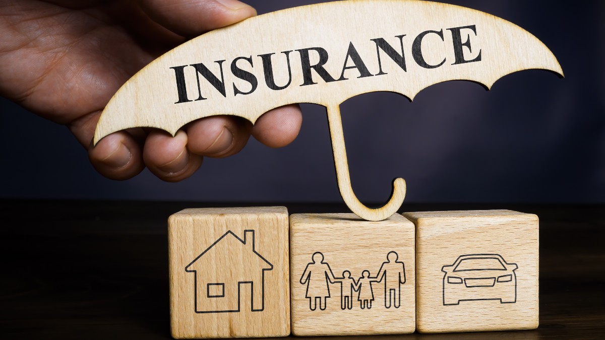 Umbrella Insurance Policy Depicted in Wooden Blocks