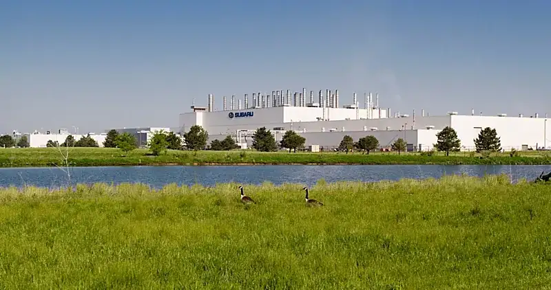 Subaru of Indiana Automotive manufacturing plant beside a pond