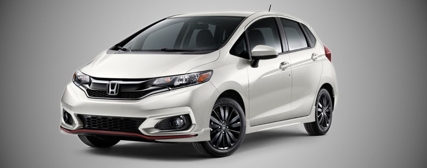 White 2020 Honda Fit against a gray background