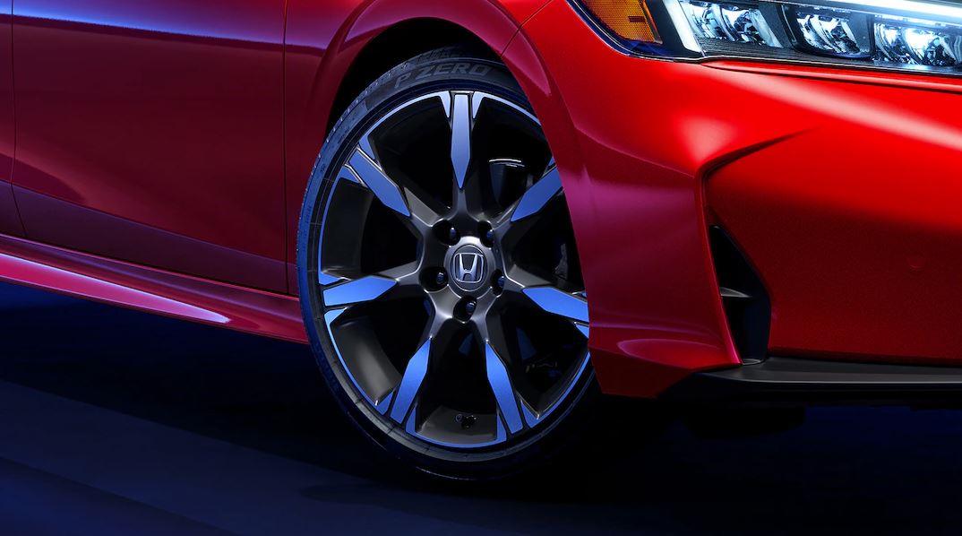 wheel of a red 2025 Honda Civic Hybrid