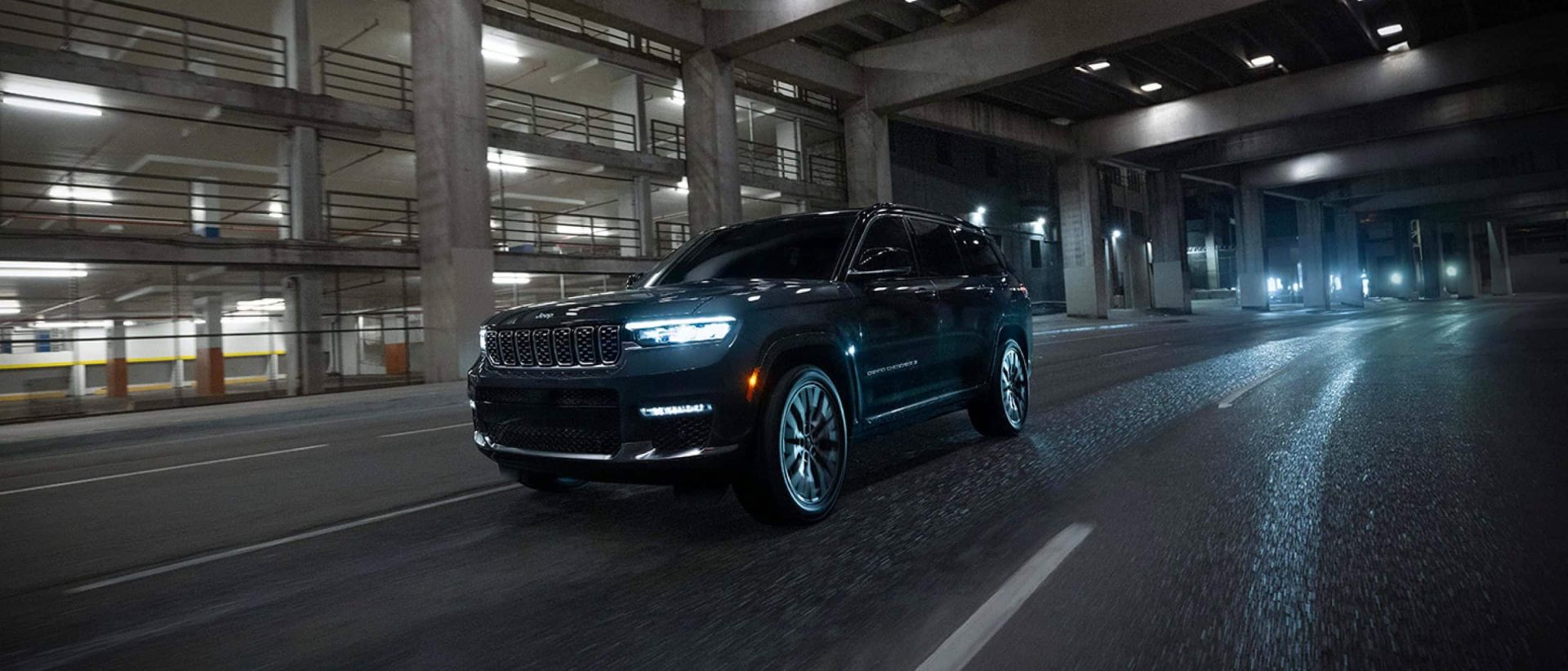 A black suv driving on the road.