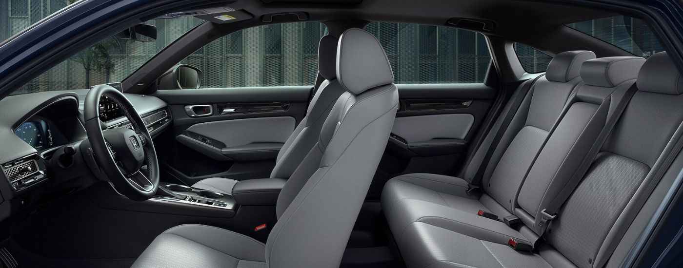 Gray leather seats in a 2026 Honda Civic Sport Touring Hybrid.