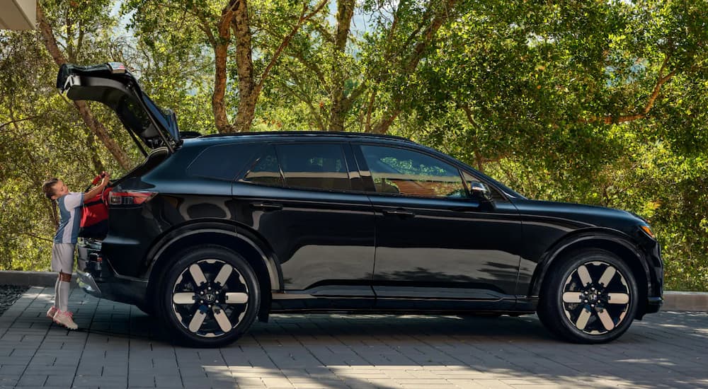Back of a black 2026 Honda Prologue being loaded with sports gear