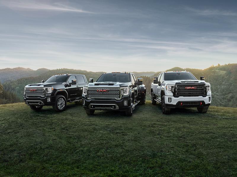 a group of gmc trucks including gmc savana