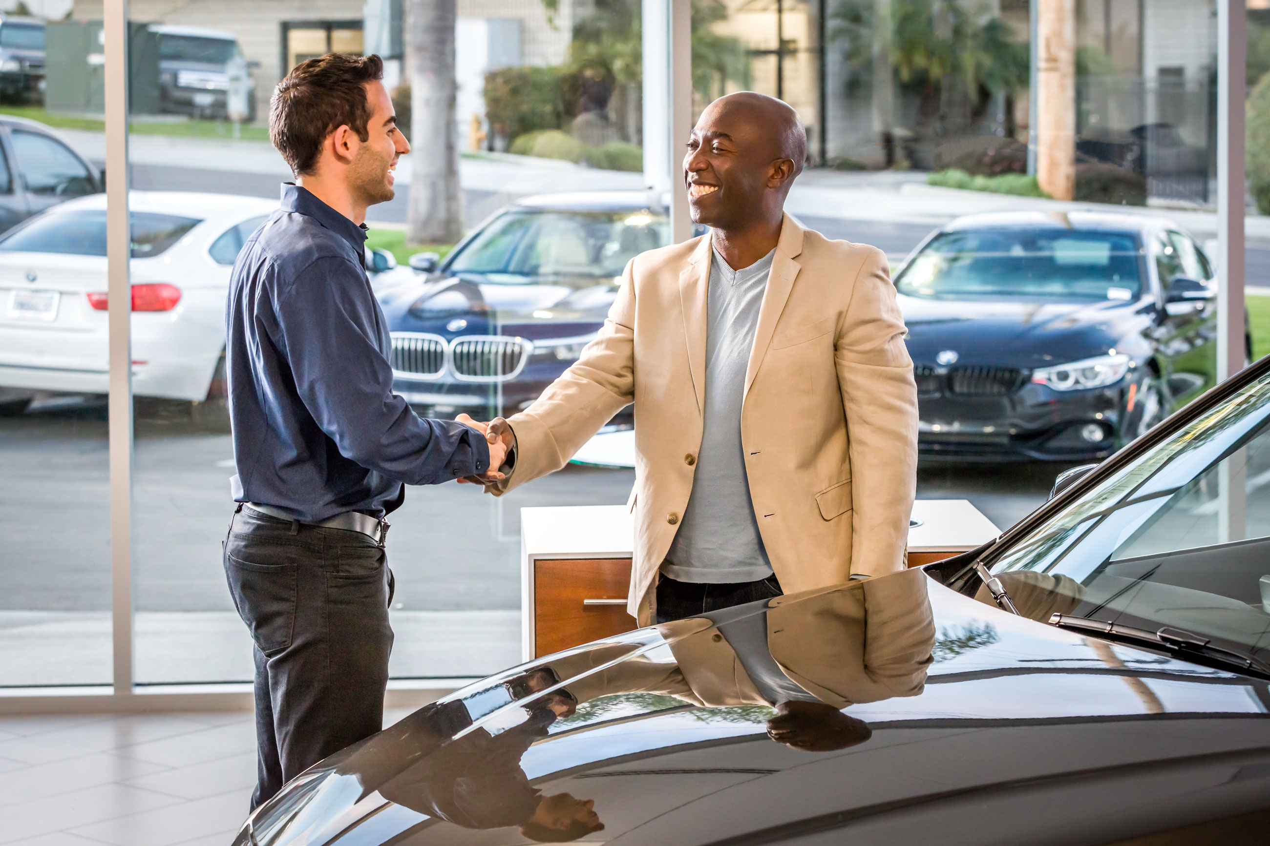 shaking hands at the BMW dealership