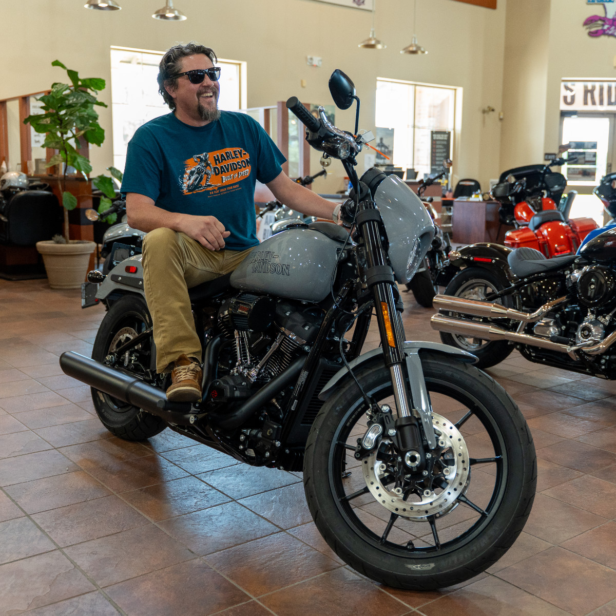 Image of guy sitting on a used harley-davidson