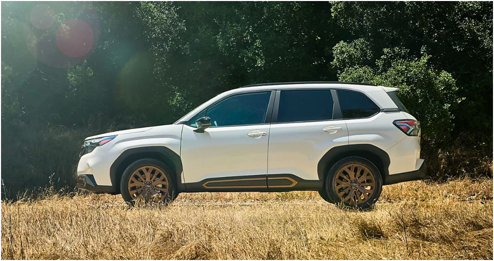 White 2025 Subaru Forester parked in a sunny meadow
