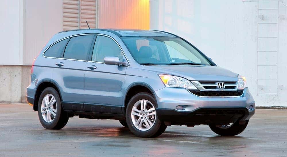 A blue used 2021 Honda CR-V parked.