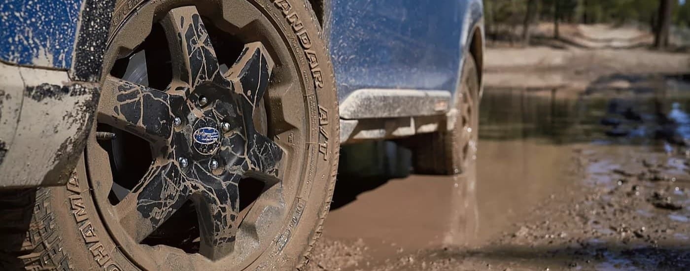 Wheels of a blue 2024 Subaru Outback Wilderness