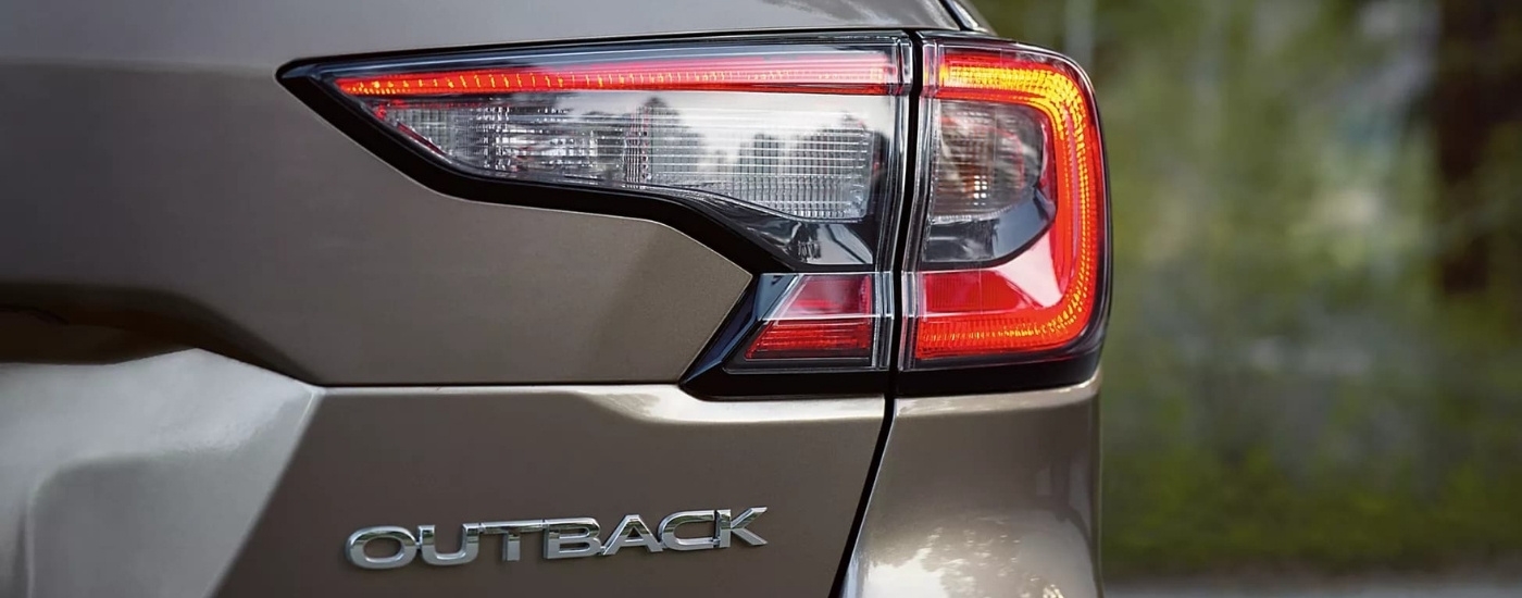 Passenger side taillight on a tan 2023 Subaru Outback.