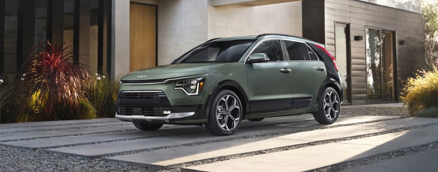 Green 2026 Kia Niro SX parked in a driveway.