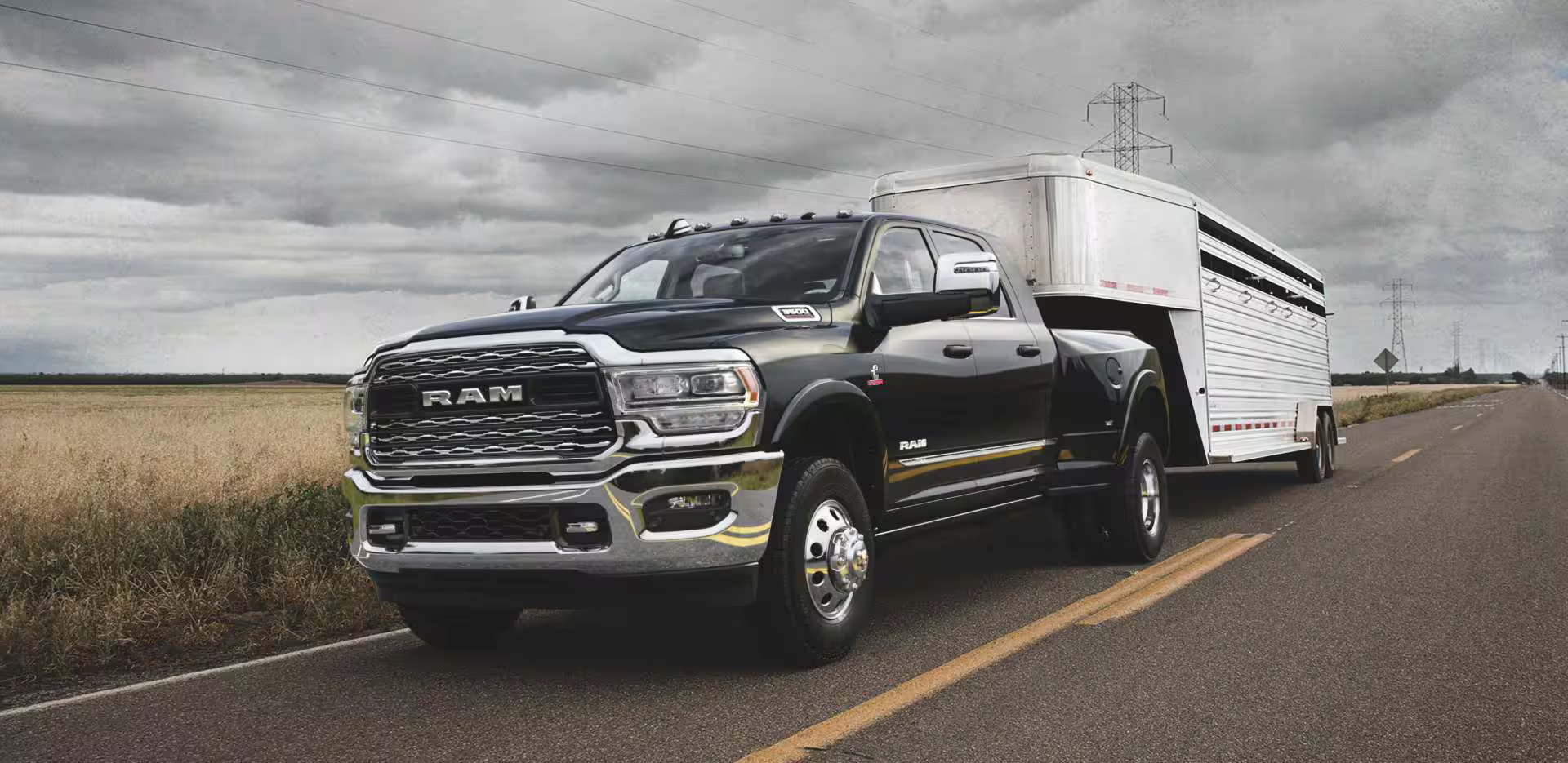 A ram 3500 pulling a trailer.