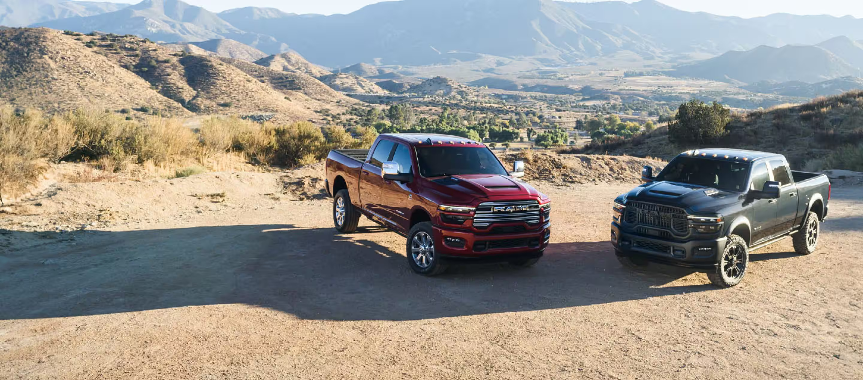 Two truck sitting parked by eachoher.
