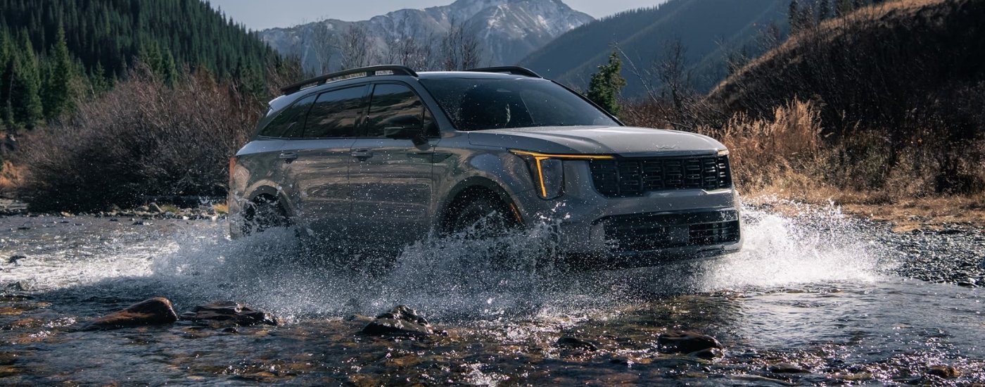 Gray 2025 Kia Sorento driving off-road
