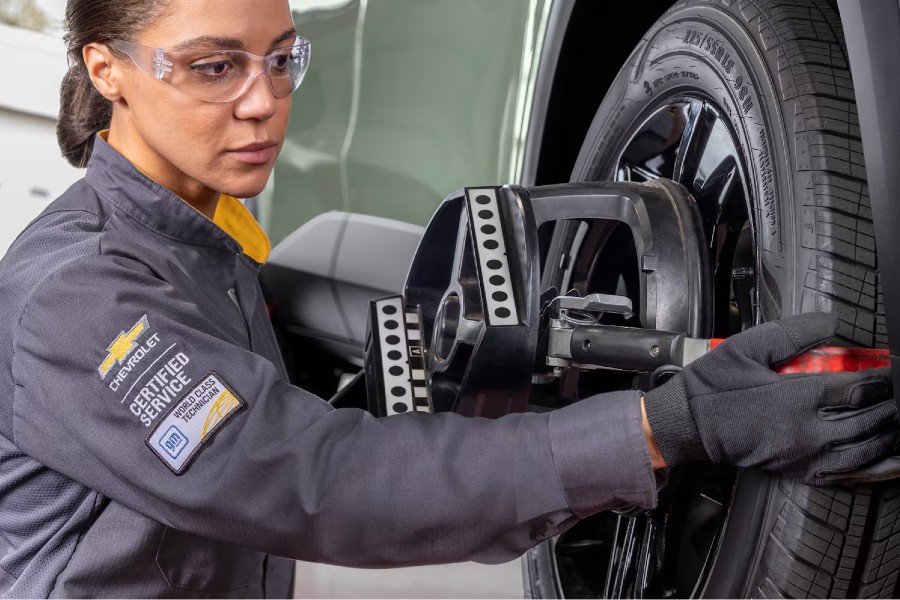 Chevy Master Technician Replacing Tire Close Up