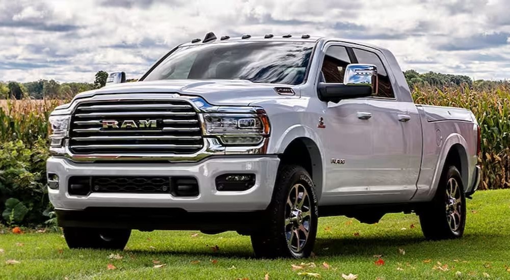 A white 2024 Ram 2500 parked next to crops.
