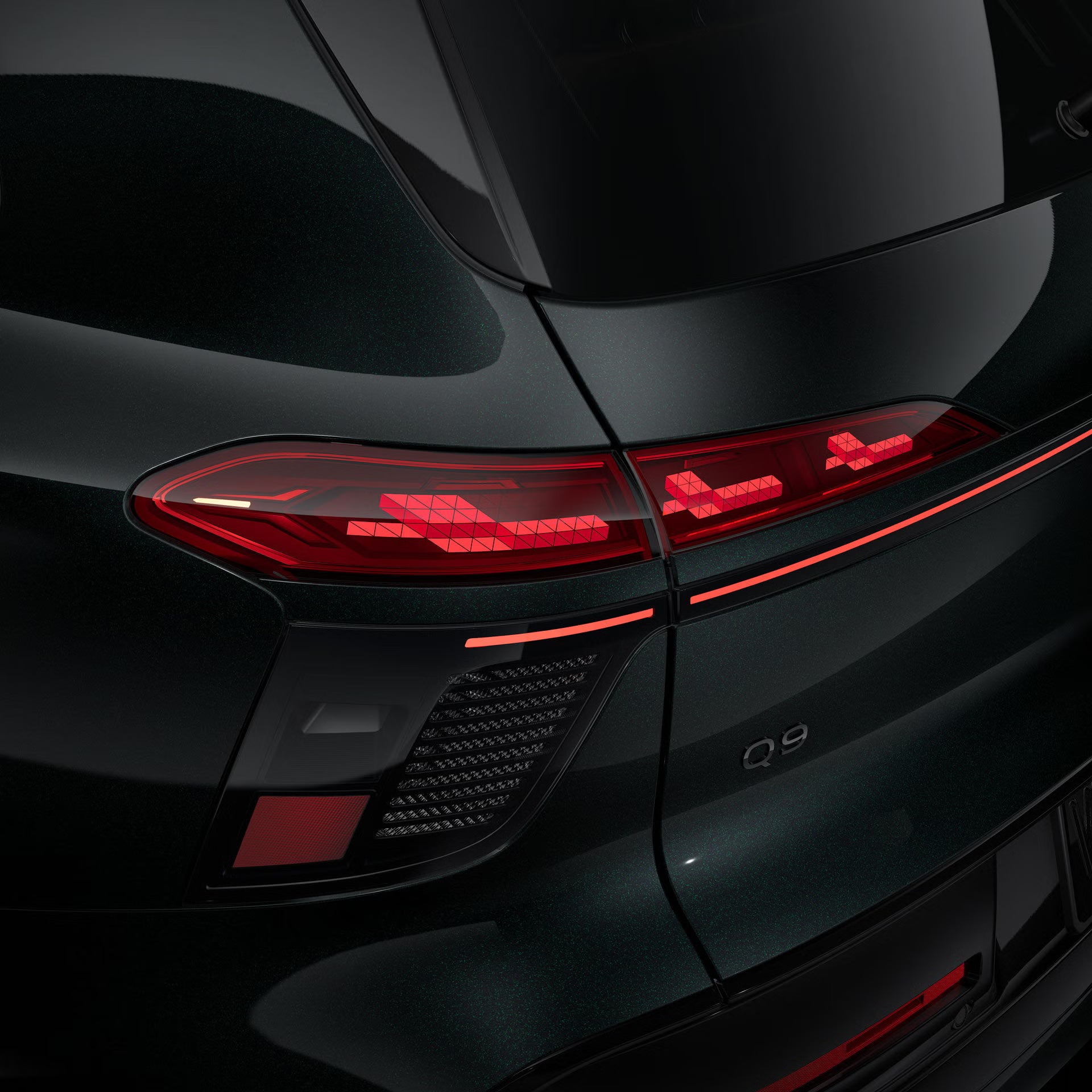 Close-up of the curved left OLED taillight on the Audi Q9.