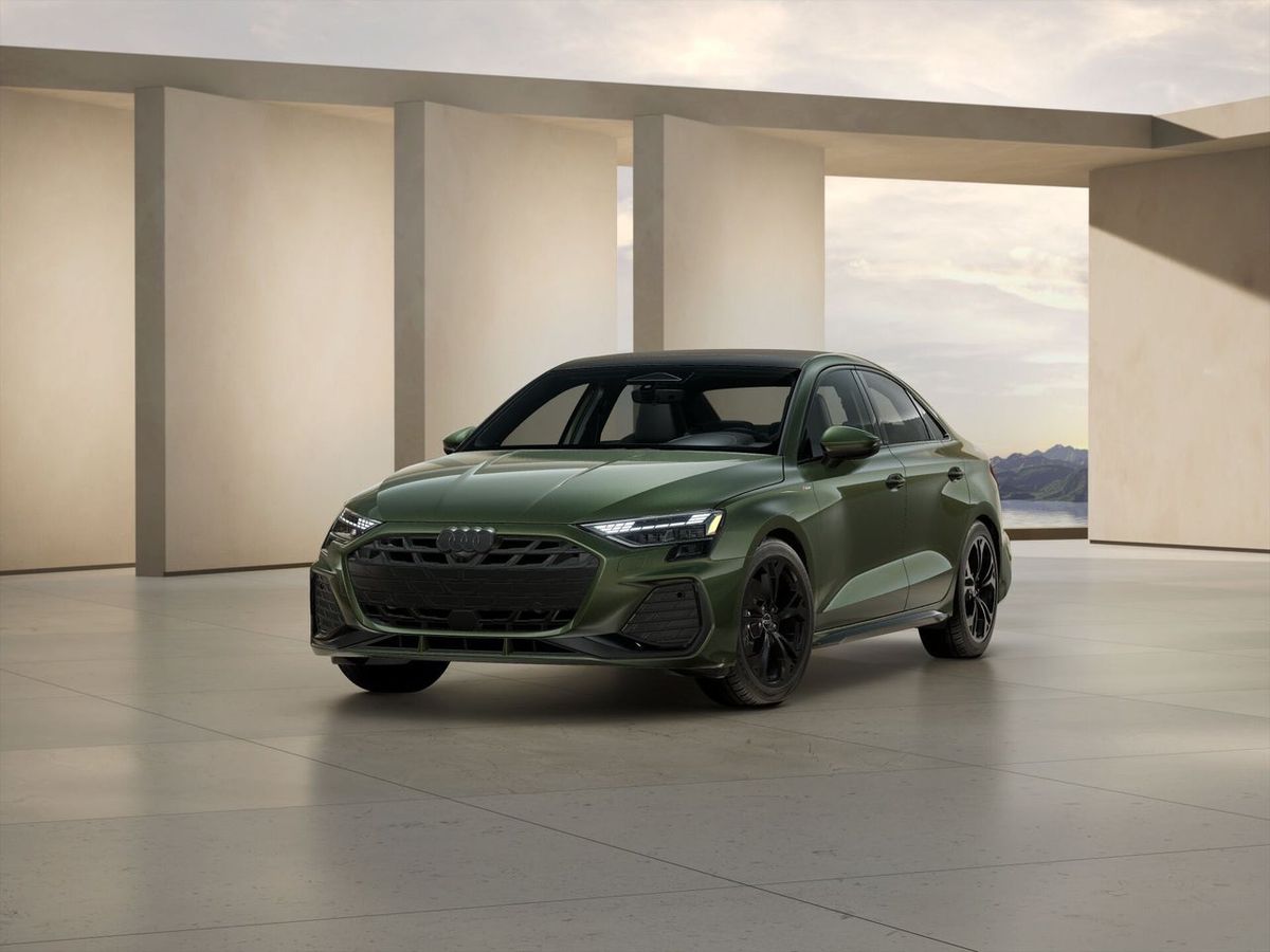 Green 2026 Audi A3 Premium Plus sedan, front three-quarter view in an Audi showroom