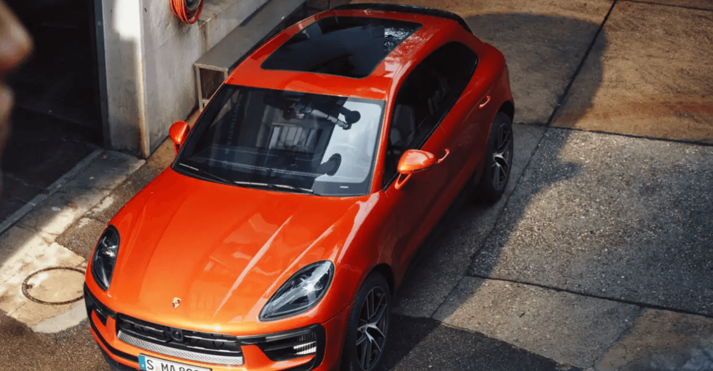 Porsche Macan EV in a side street.