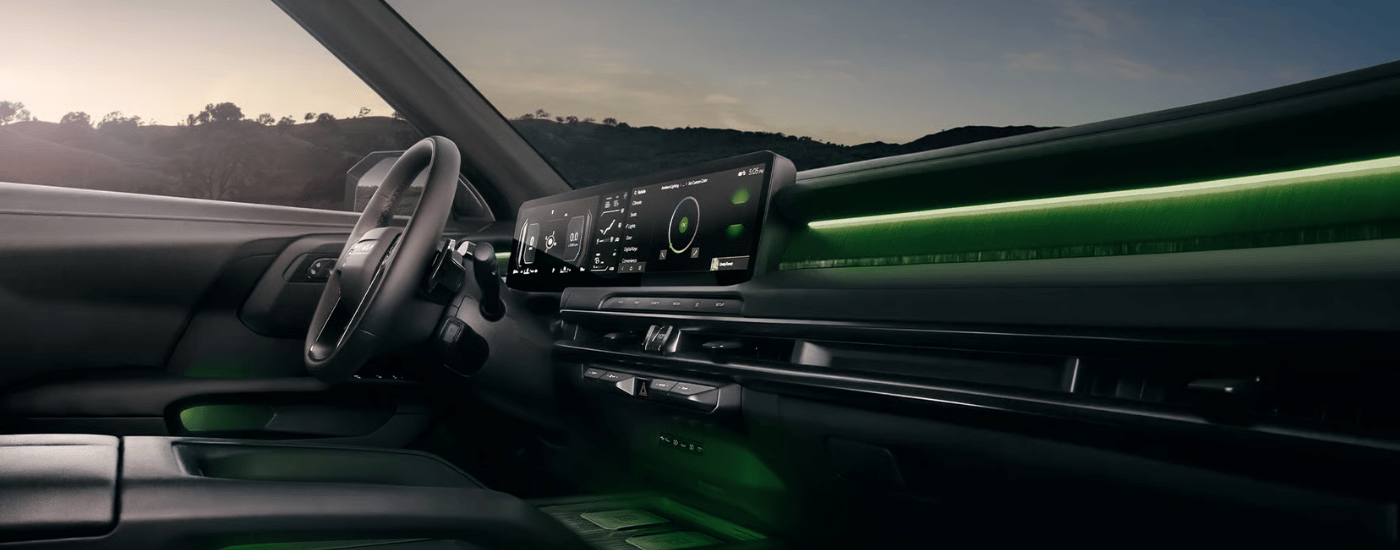 Black leather interior of a 2027 Kia Telluride with green LED lights