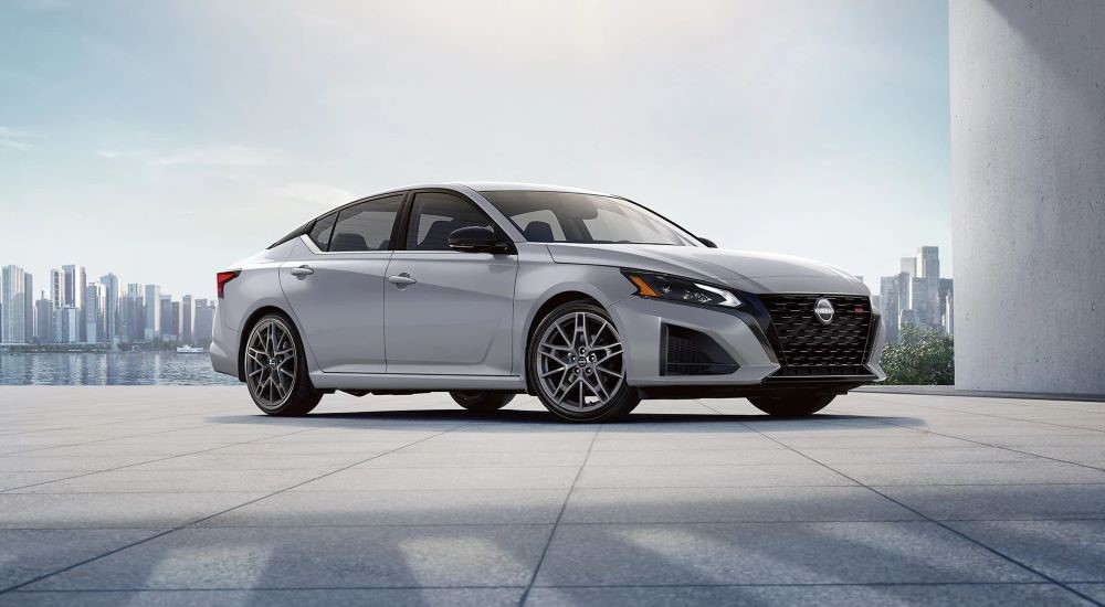 White 2023 Nissan Altima SR parked near a city