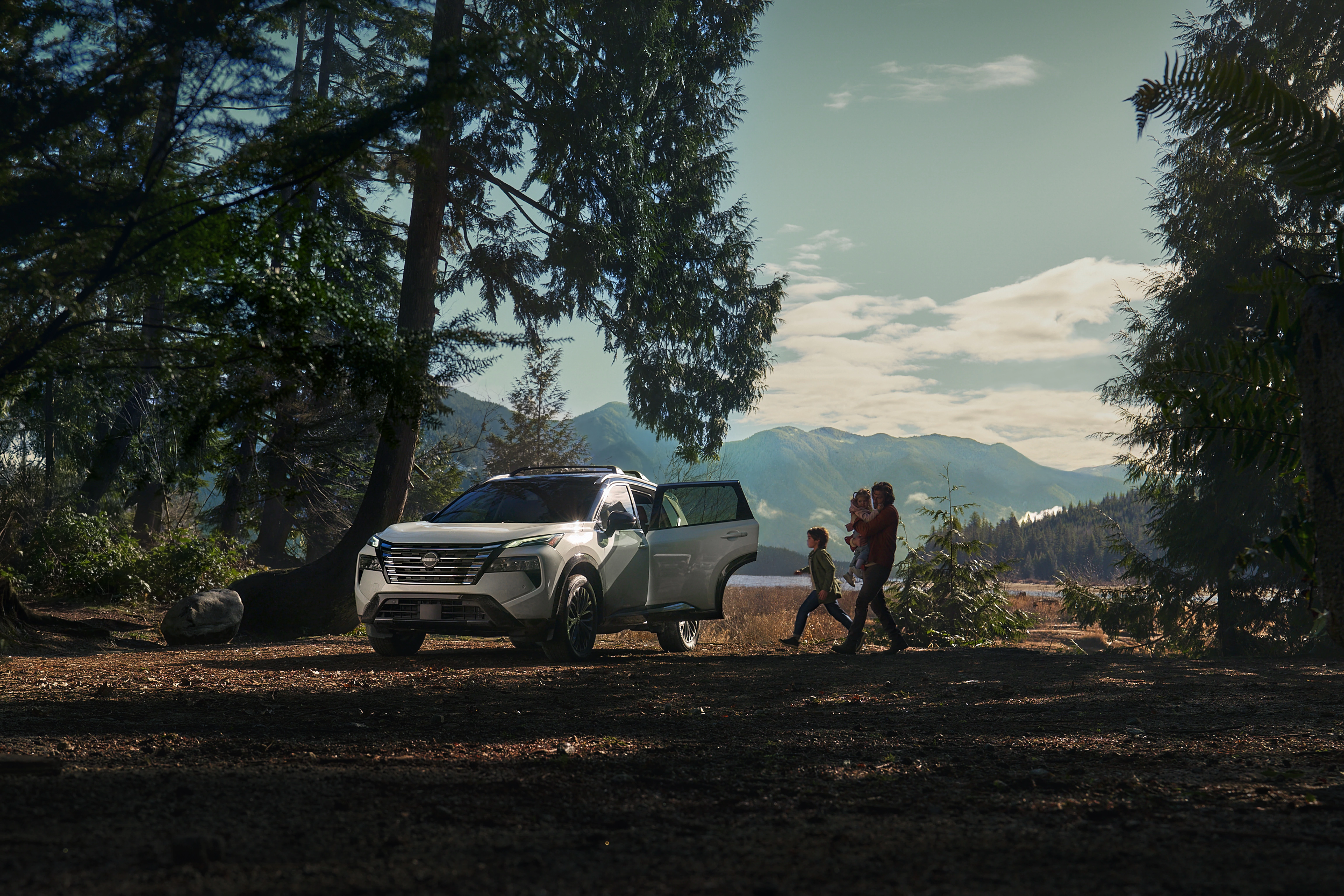 2026 Nissan Rogue parked at a mountain lake overlook