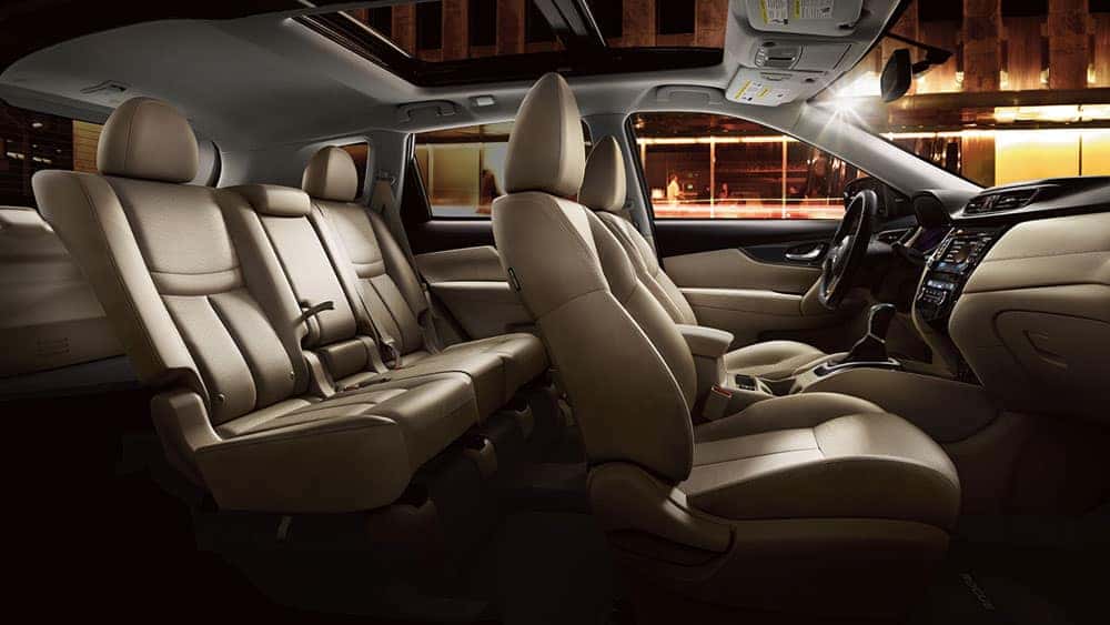 2017 Nissan Rogue cabin with tan leather front and rear seats