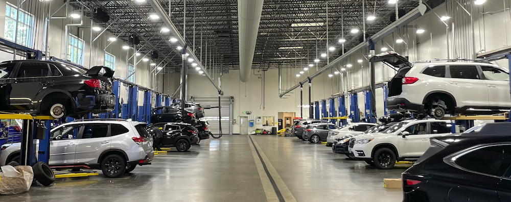 Wilsonville Subaru service department with vehicles on lifts
