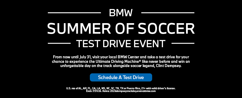 Clint Dempsey standing in front of the BMW X3, X5, & 3 Series on a test track.