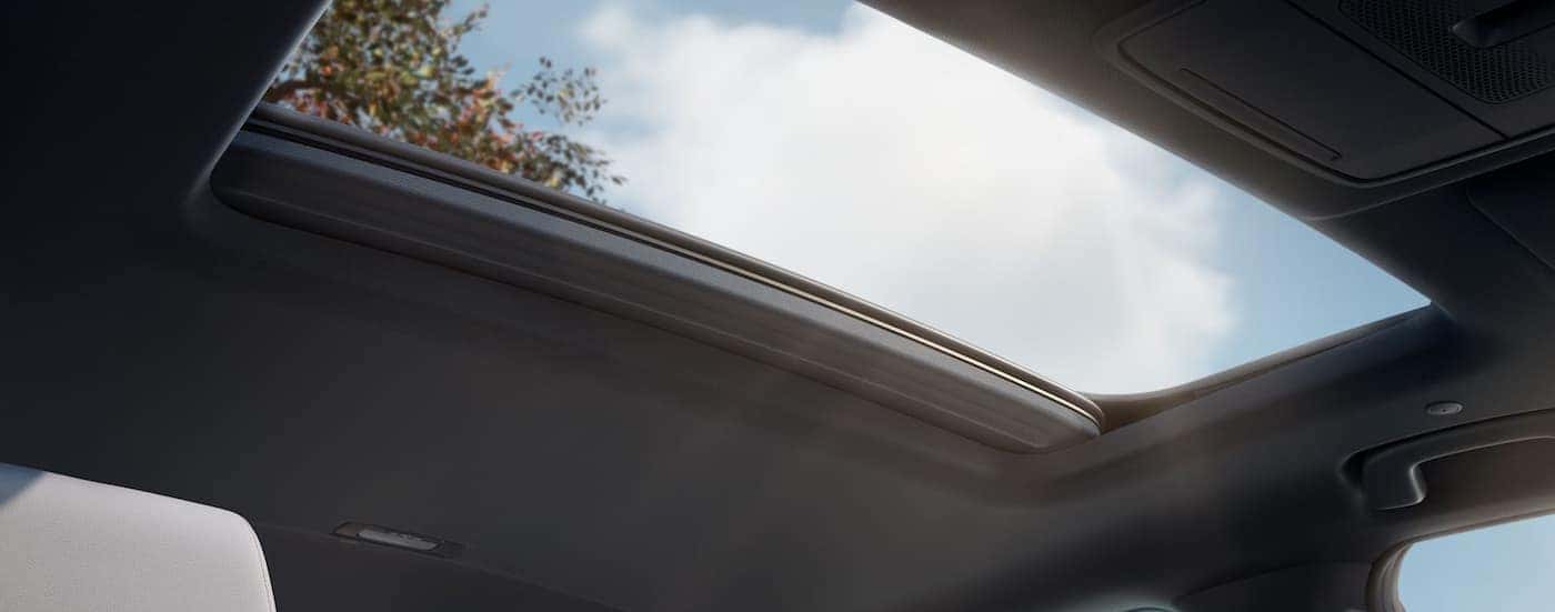 A close-up of the sunroof is shown in a 2025 Honda CR-V Sport Touring.