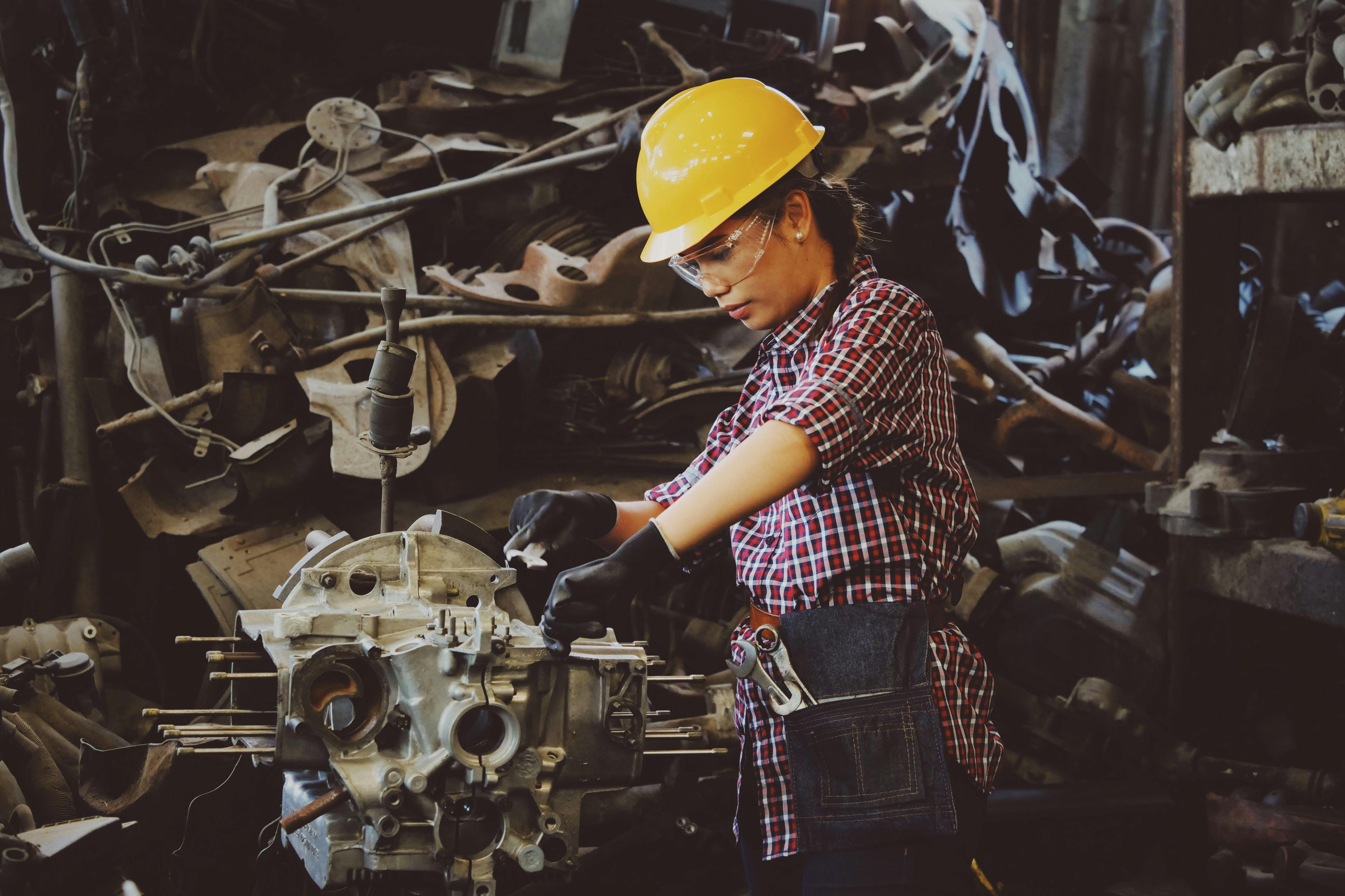 Mechanic performing routine maintenance on a heavy-duty truck in a service bay