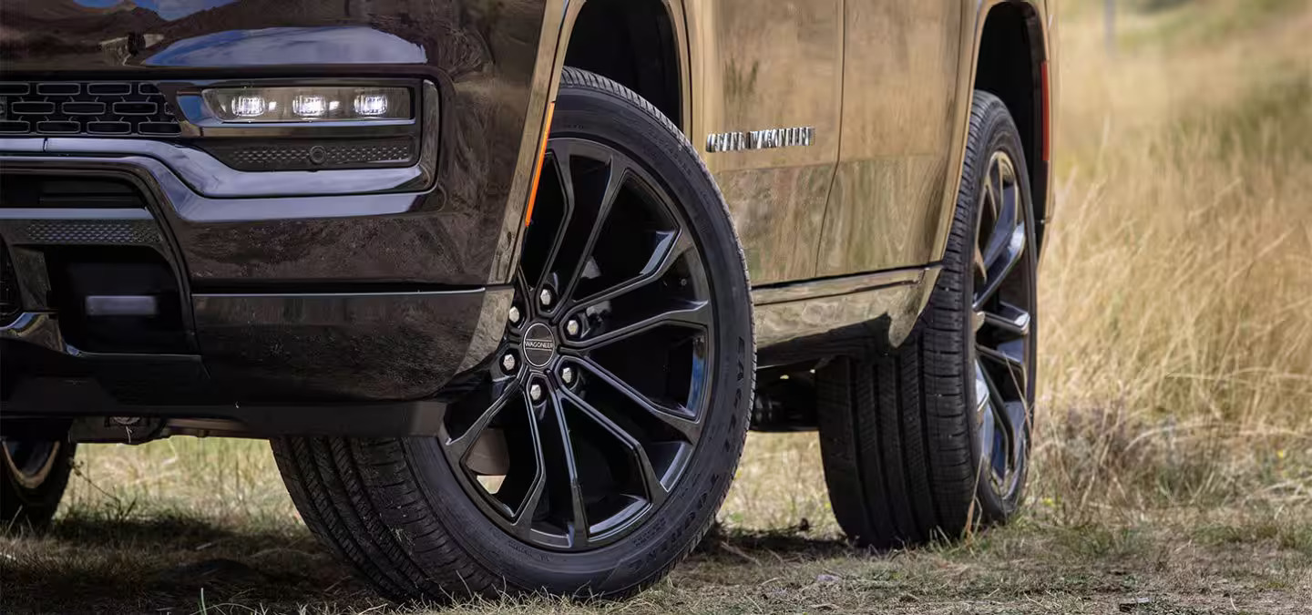 An up close view the wheels on the jeep grand wagoneer.