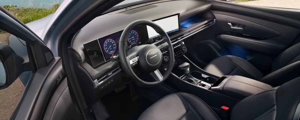Driver's seat, steering wheel and digital gauges in the 2025 Hyundai Santa Cruz