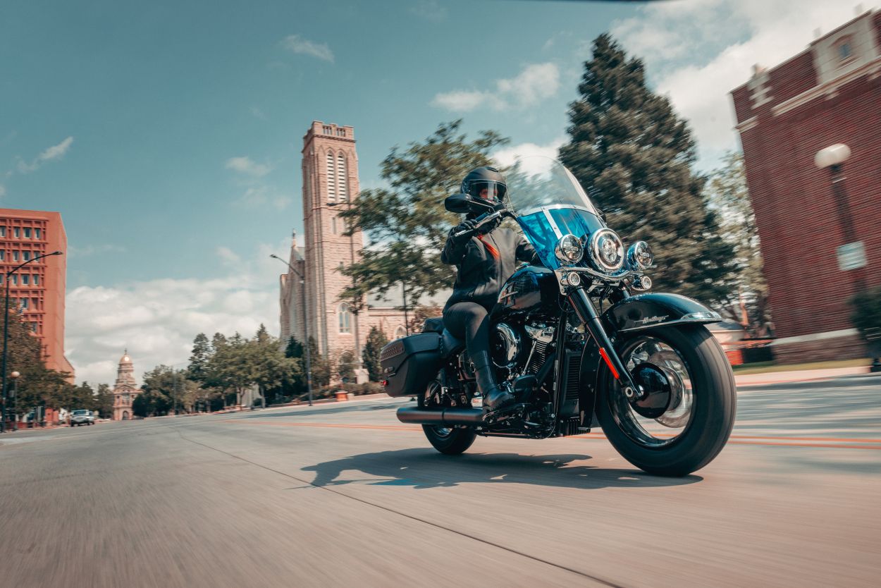 2026 Harley-Davidson Heritage Classic driving down vintage-looking street