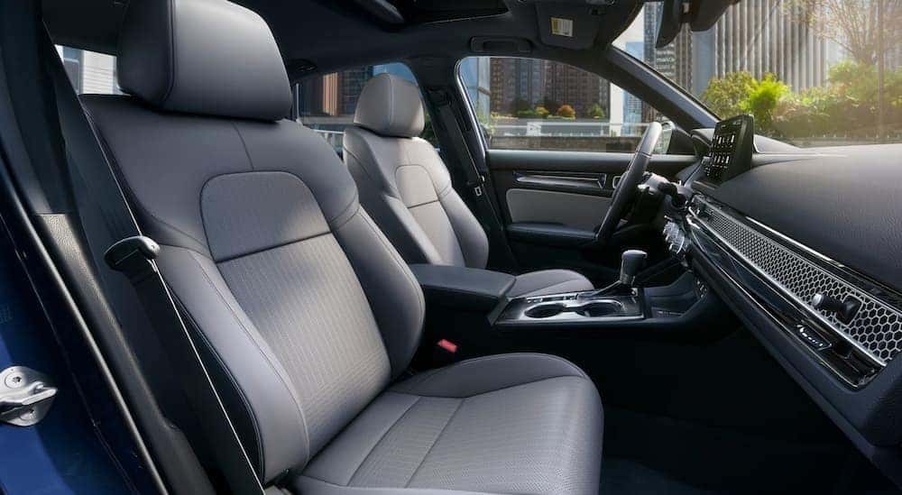The gray interior and dash are shown in a 2025 Honda Civic Sport.