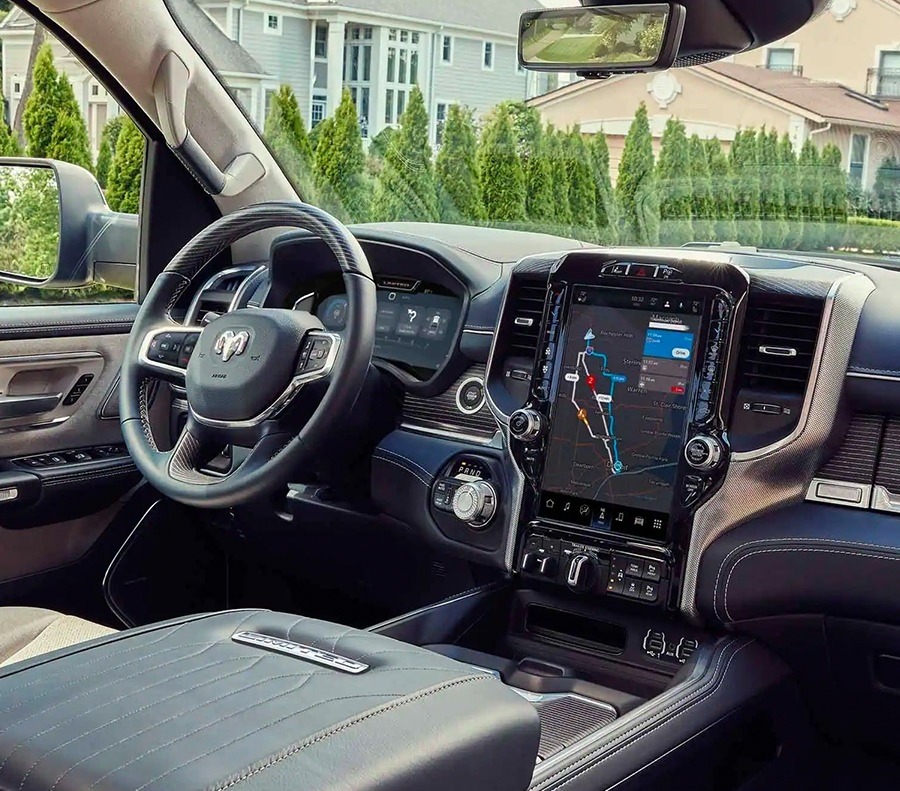 Ram truck cabin with a large touchscreen display and leather dashboard