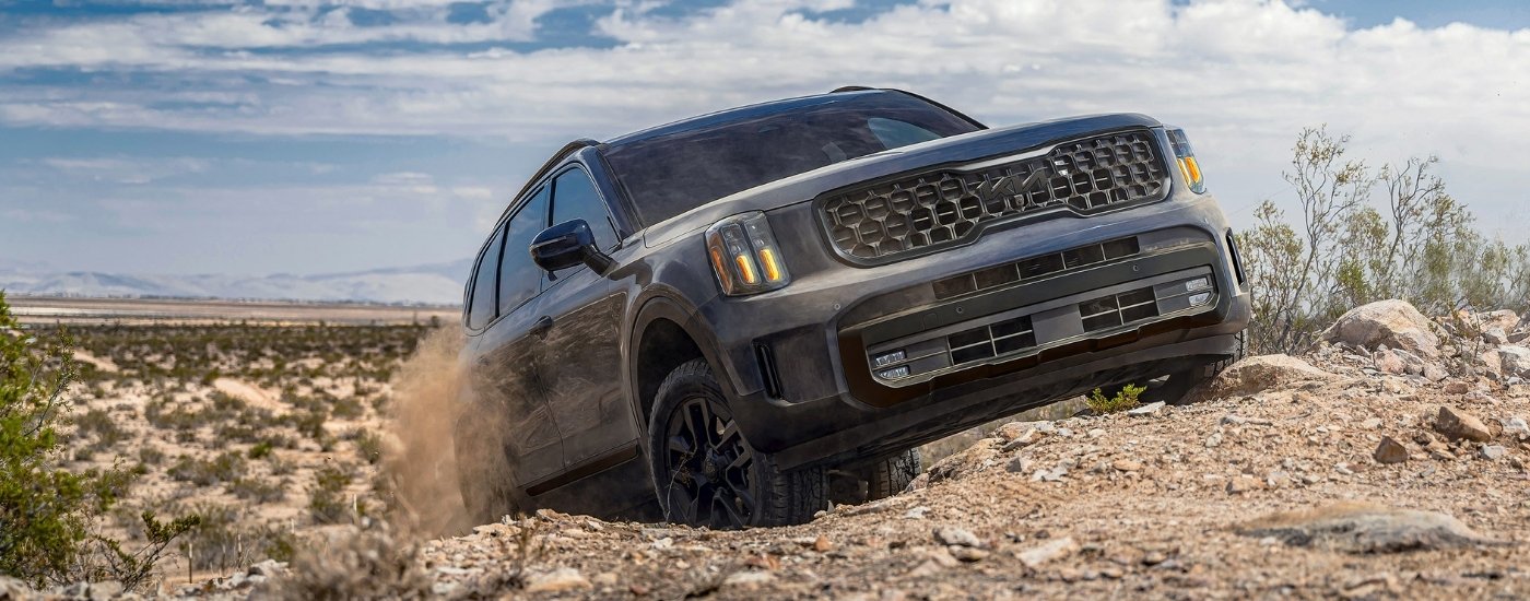 Gray 2025 Kia Telluride off-roading on rocky terrain