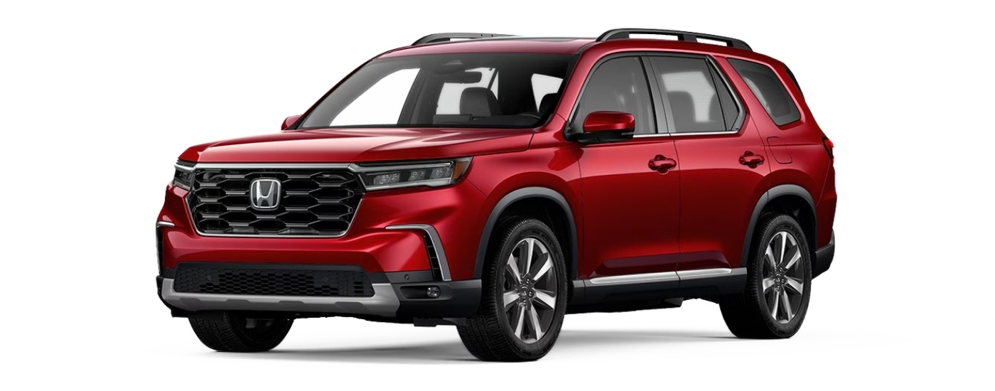 Red 2025 Honda Pilot Touring angled left