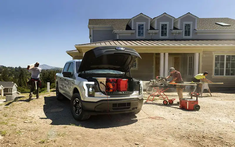 image of silver ford f-150 lightning with front storage compartment open