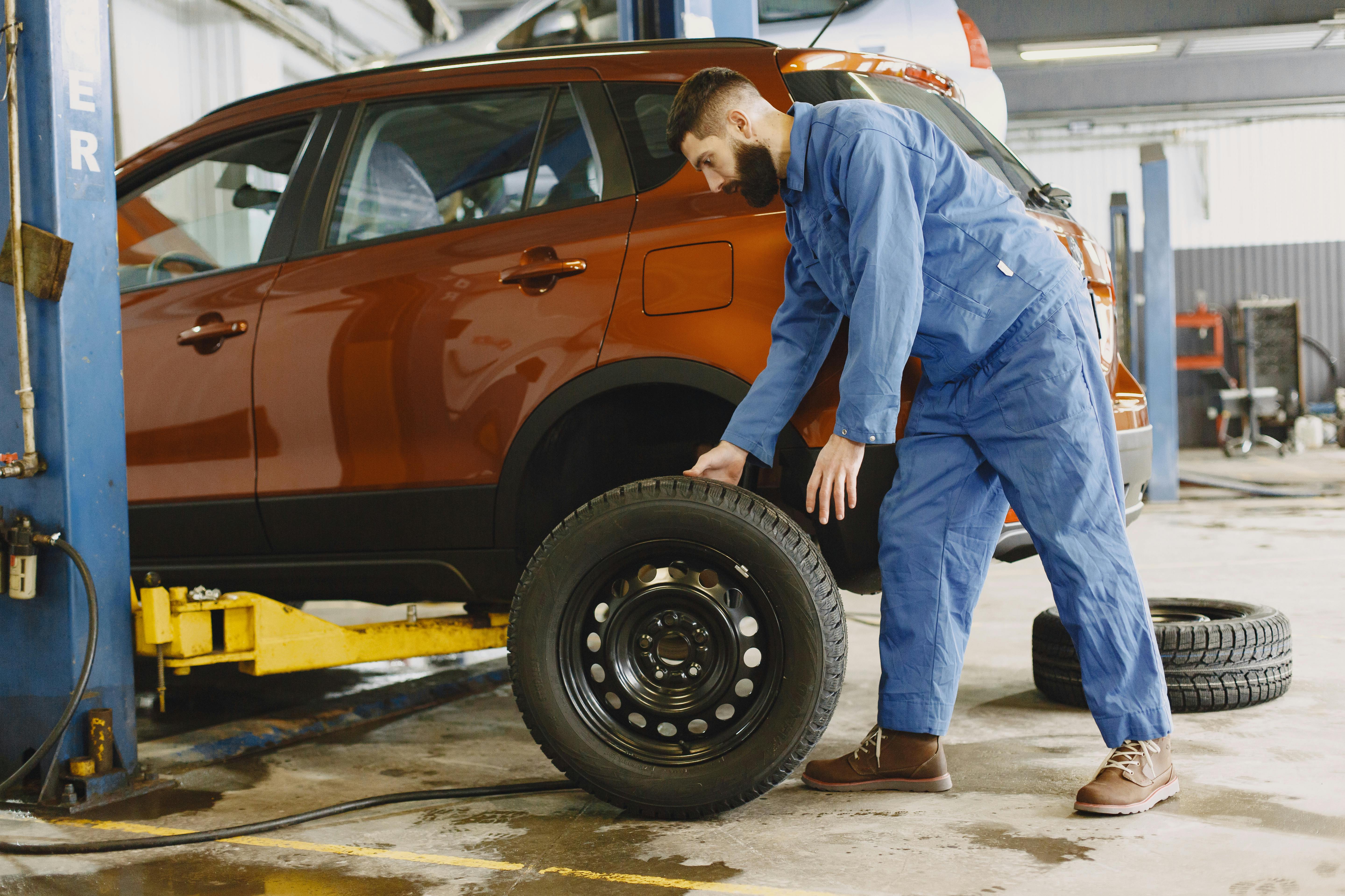 Ford service technician using diagnostic equipment