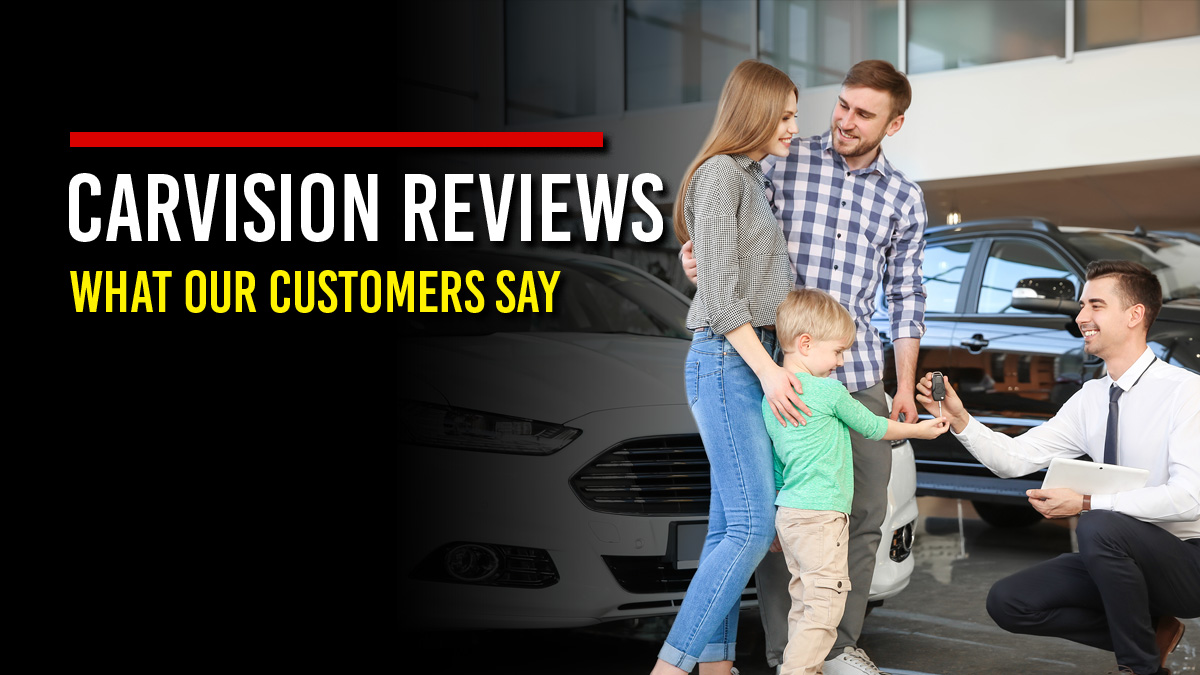 Smiling salesperson kneeling to hand car keys to a young boy as his parents look on in a car dealership showroom, next to the headline “CarVision Reviews: What Our Customers Say”