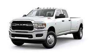 a white Ram truck in a front driver side view with a white background.