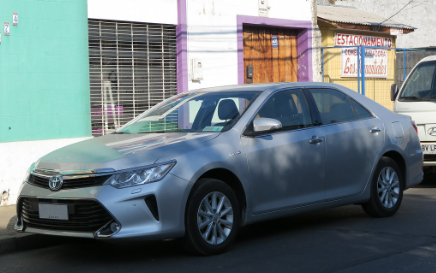 2017 Toyota Camry Hybrid parked along a street in Kirksville, MO.